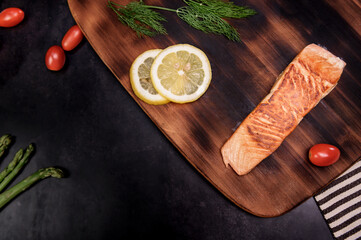 Cooking salmon steak with salad. Homemade fresh fish for healthy and diet food.