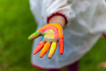 girl playing with colored paints