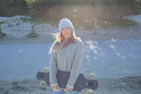 Portrait Beautiful Young Woman With Skateboard