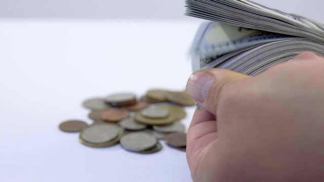 hands with money and background of coins