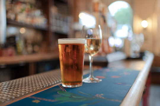 Close up beer and white wine on bar counter