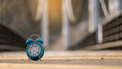 Naklejka premium A blue watch placed on the roadway on a pedestrian bridge.