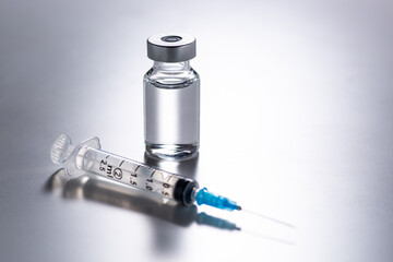 syringe and vaccine bottle