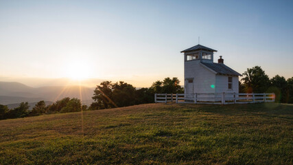 Fototapeta premium Clear skies at sunset viewed from a historic fire watchtower within the foothills of Shenandoah National Park.