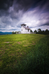 An old fire watchtower atop the foothills of Shenandoah National Park on a cloudy afternoon Summer day.