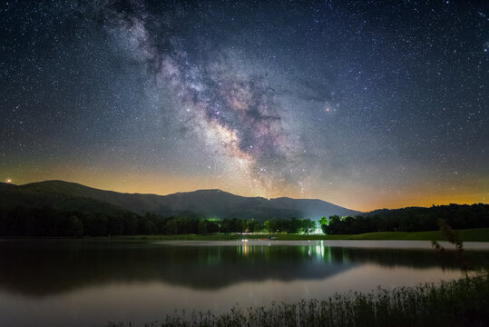 The Milky Way shining over Shenandoah National Park viewed from Lake Arrowhead in Luray, Virginia.
