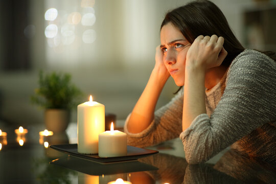 Angry Homeowner Using Candles During Power Outage