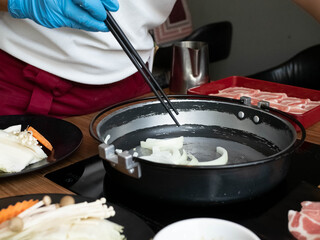 Chef restuarant kitchen wear glove mask blue is cooking chopstick shabu suki buffet healthy  vegetable pork seafood beef customer asian japanese korean china eat warm hot for protect covid-19 disease