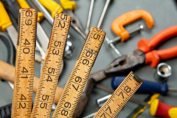 Wood metric isolated on blurred background with a variety of tools.