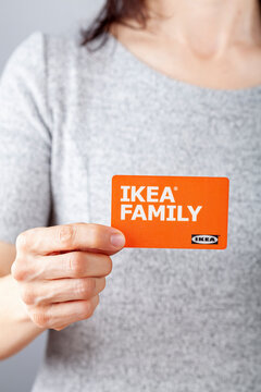 Clarksburg, MD, USA 02-25-2021: A caucasian woman is holding an Ikea Family membership card in her hand. This card offers in store and online shopping discounts on eligible purchases  from Ikea.