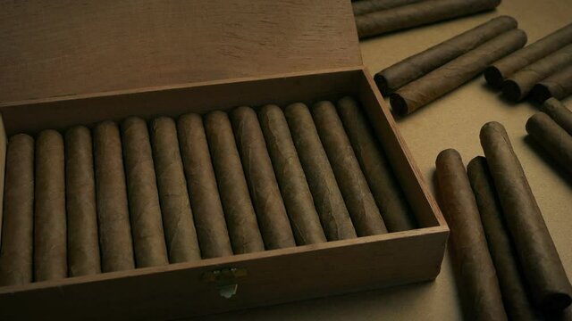 Cigar Box With Many Cigars Around