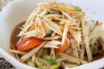 Spicy green papaya salad serve