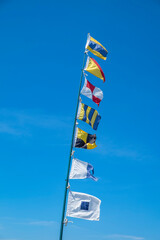 Nautical flags blowing in wind, USA