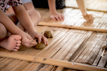 Asian children are making clay