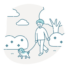 犬と公園を散歩する男性