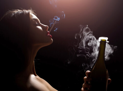 Closeup Portrait Of Young Sexy Woman Smoking Cigarette In Studio On Black Background