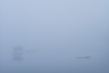 USA, Massachusetts, Cape Ann, Gloucester. Annisquam Harbor, boats in fog