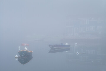 USA, Massachusetts, Cape Ann, Gloucester. Annisquam Harbor, boats in fog