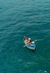 Fototapeta na wymiar Fishermen in Small fishing boat with fishing net and equipment