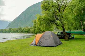 camping on the beach in mountains. Chulyschman valley, Altai.