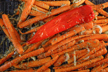 Oven roasted carrots with rosemary and a red pepper.