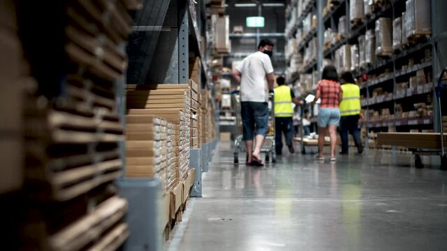 Beautiful womanBangkok, thailand March 27, 2020 : Ikea Bangna branch in Thailand with group crowd of people with lifestyle shopping for new furniture. Caucasian female pay via mobile phone.