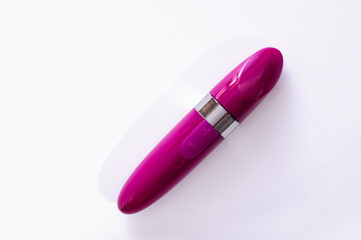 vibrator for clitoral stimulation and pleasure, mini lipstick vibrator, on a white background