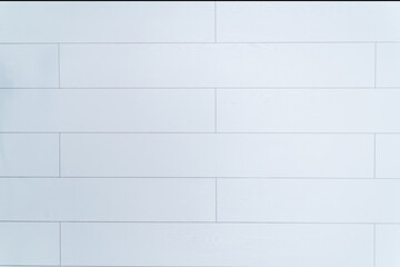 texture of white laminate flooring. on the background of the white surface of the walls made of...
