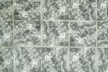 the texture of the surface of the green stone tiles with patterns. background of colored tiles. wall and floor surfaces