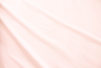 Fototapeta premium Fabric texture with light waves. A sheet of delicate color.
