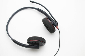 Headphones with microphone on a white background.