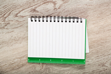 Open notebook with pages in line on table