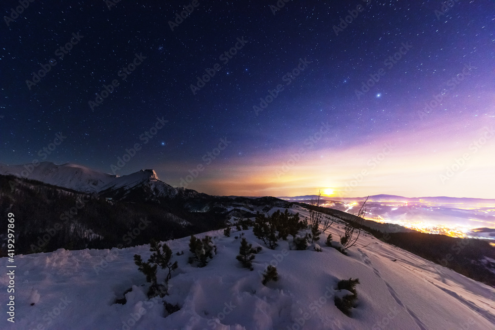 Wall mural night winter landscapes in the high tatras, with mountain houses on a background of snow-capped moun