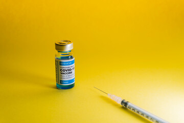 Vaccine for Coronavirus or Covid 19 with Yellow background. Medical and healthcare concept.