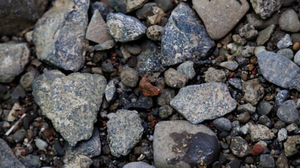 rock shards on the ground in the yard, not focus and noise image