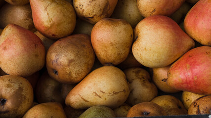 red pears in a market