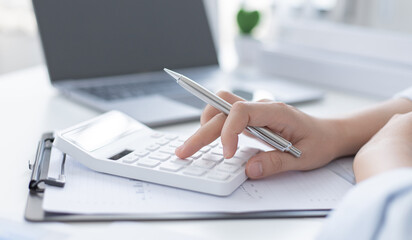 Accounting businesswomen are calculating income-expenditure and analyzing real estate investment...