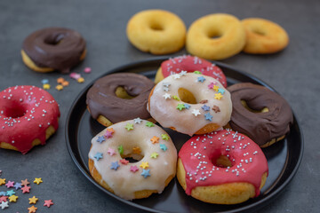 Donuts pattern. Top view of assorted glazed donuts