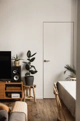 Fotobehang Per kamer Modern minimal home, living room interior design concept. White walls, door, tv, loudspeakers, wooden floor, sofa. Apartment for rent.  © Floral Deco