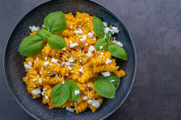 Creamy roasted pumpkin penne pasta on a table