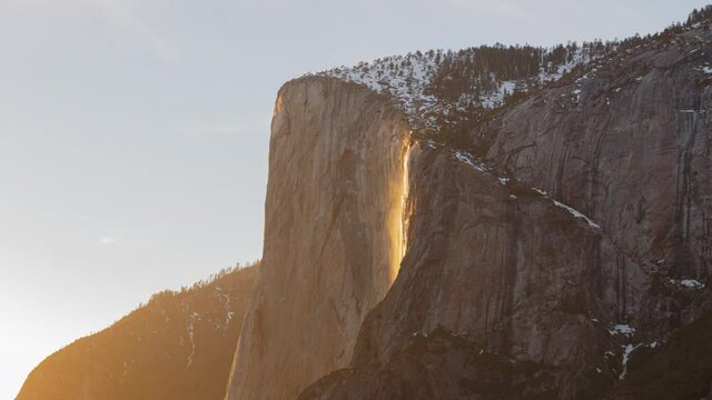 Time lapse of Firefall, a seasonal waterfall illuminated by the late sunlight in Yosemite National Park in California
