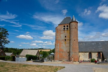 Fototapeta na wymiar Hary France - 1 August 2020 - Fortified church (Eglise Saint-Corneille-et-Saintin) Hary (Aisne - Thiérache) France