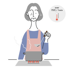 食中毒予防のために加熱調理をするシニア女性