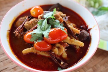 Kanom Jeen Nam Ngiao is a popular local food in the North. With pork and a variety of vegetables