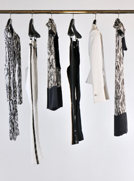 Elegant and trendy women's clothes hanging