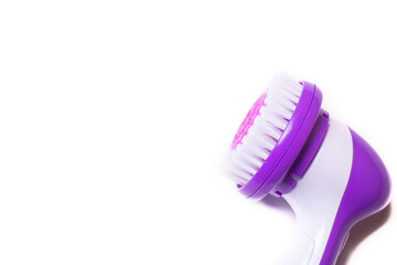 Electric isolate facial massager . Purple massager. Facial care. Cosmetology. Women's care . Article about the health of the face . . Copy space
