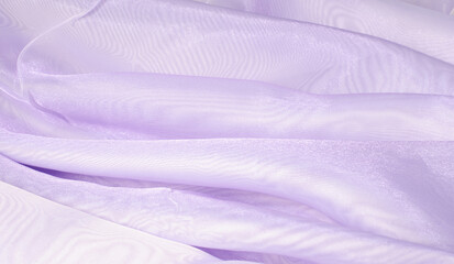 The texture of a silky, wavy, lilac fabric.