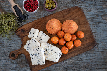 Local foods on the wooden table like sürk, testi peyniri and carra peyniri