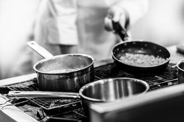 Chef cooking Chef preparing food in a kitchen, chef at work, Black and White.