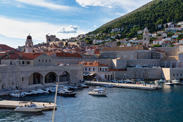 Fototapeta na wymiar Old town of Dubrovnik with its old port full of boats. Dubrovnik Old Harbour